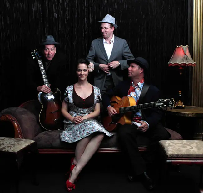 The Irwell Street String Band with Hetty Kate, Sam Lemann, Andy Baylor and Leigh Barker posed together in a vintage Melbourne lounge